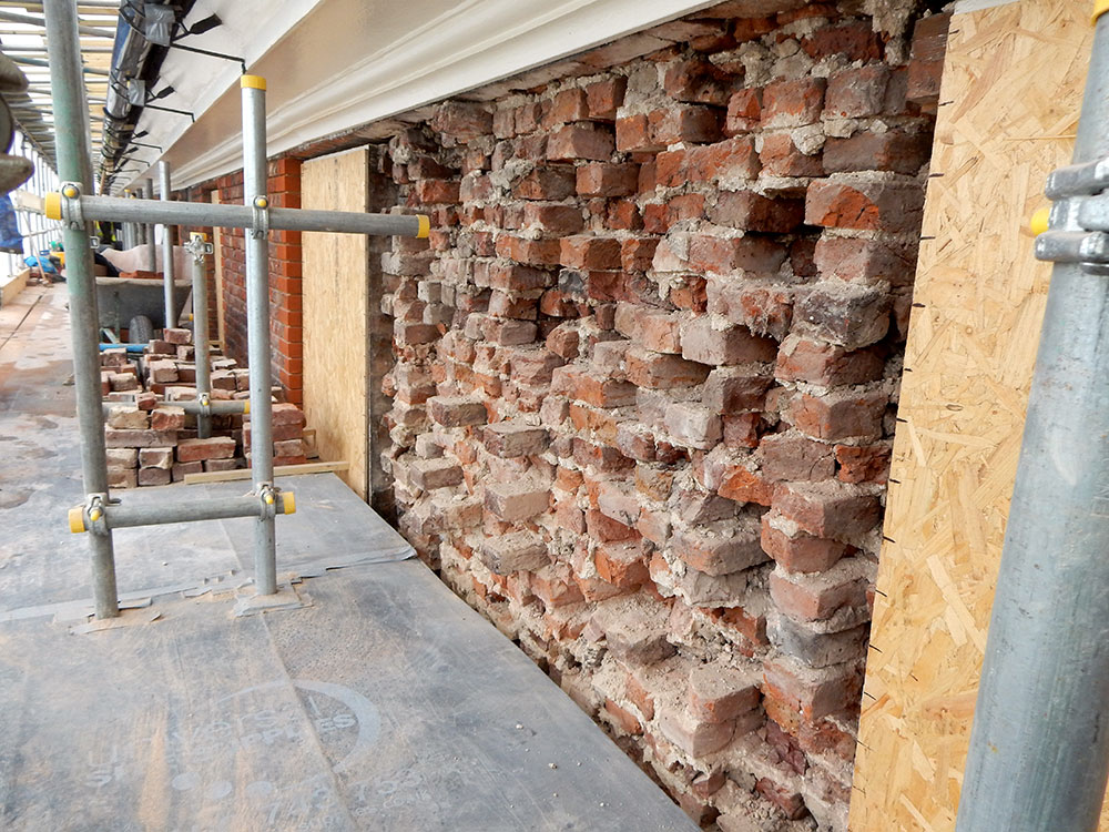 Wall core awaiting facing bricks GHK Architects