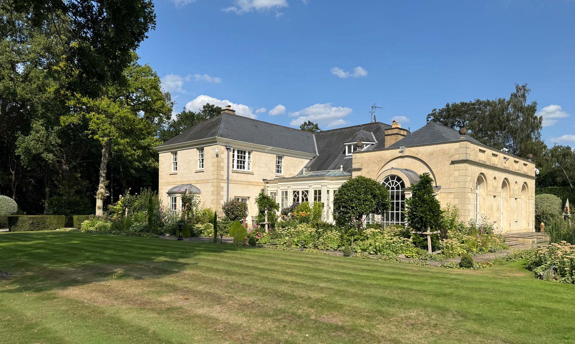 Bulstrode Manor Farm view across lawn - GHK Architects
